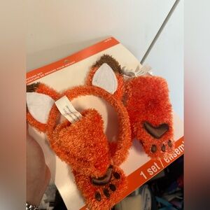 New fox costume ears and paws.  Just add sweatsuit. 
One size.  Plush.